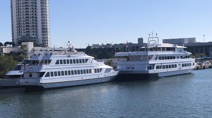 A view of the Accommodations Along the Riverwalk with a Yacht Starship in the foreground