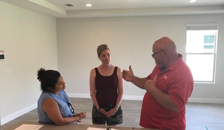 A couple doing a final walkthrough of a house